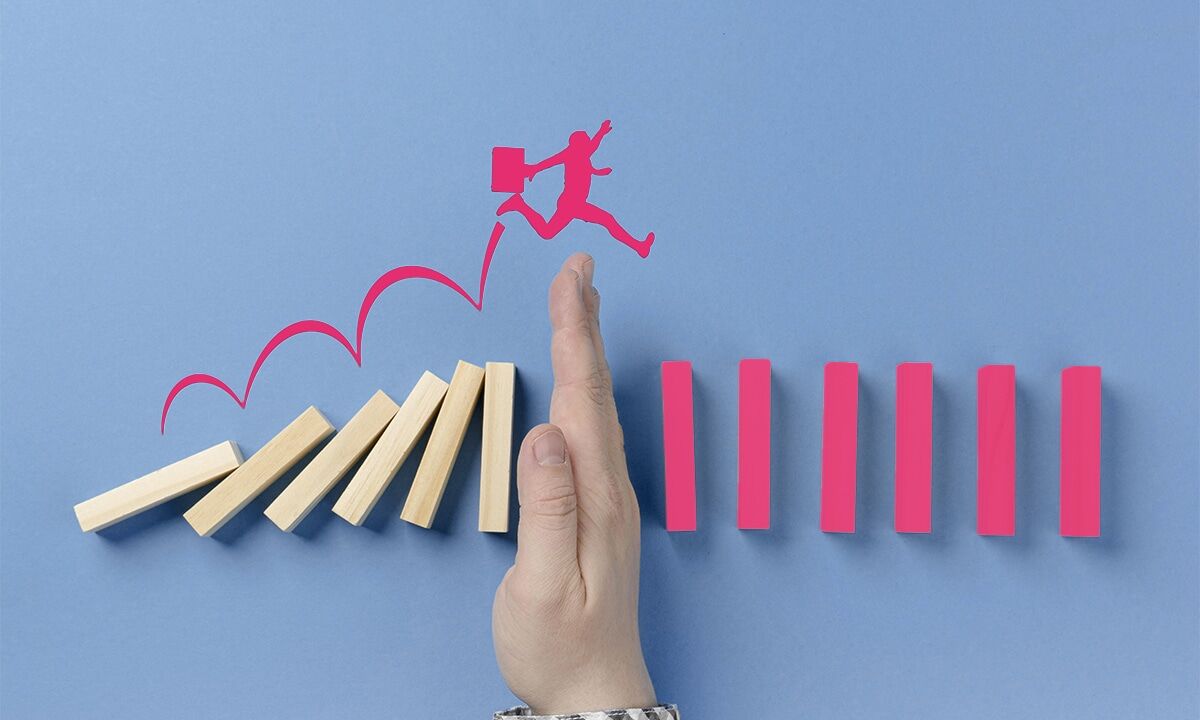 man jumping over a hand
